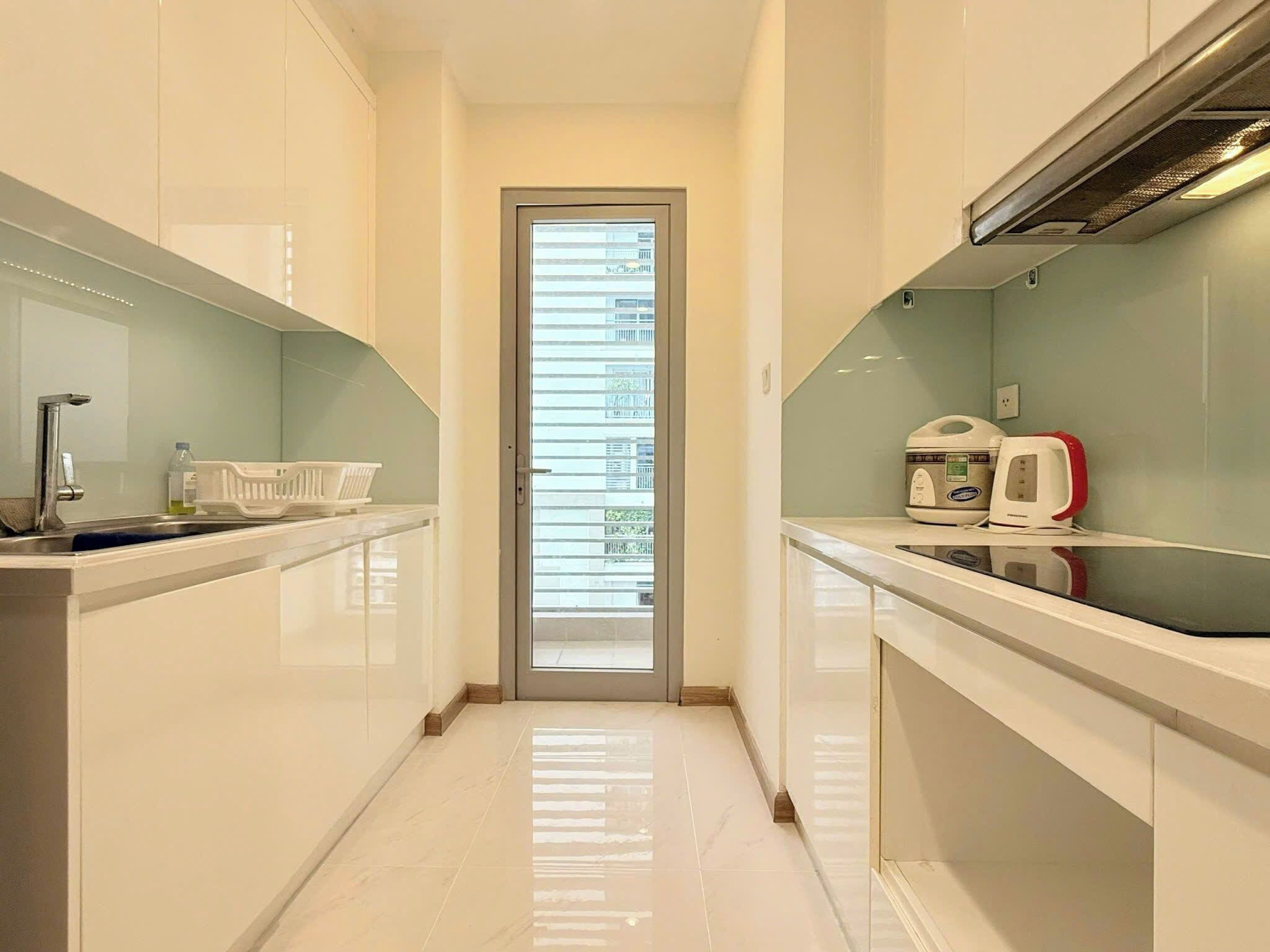 Departamento estándar, 2 habitaciones, vista a la ciudad | Cocina privada | Refrigerador, microondas, parrilla de estufa y arrocera 