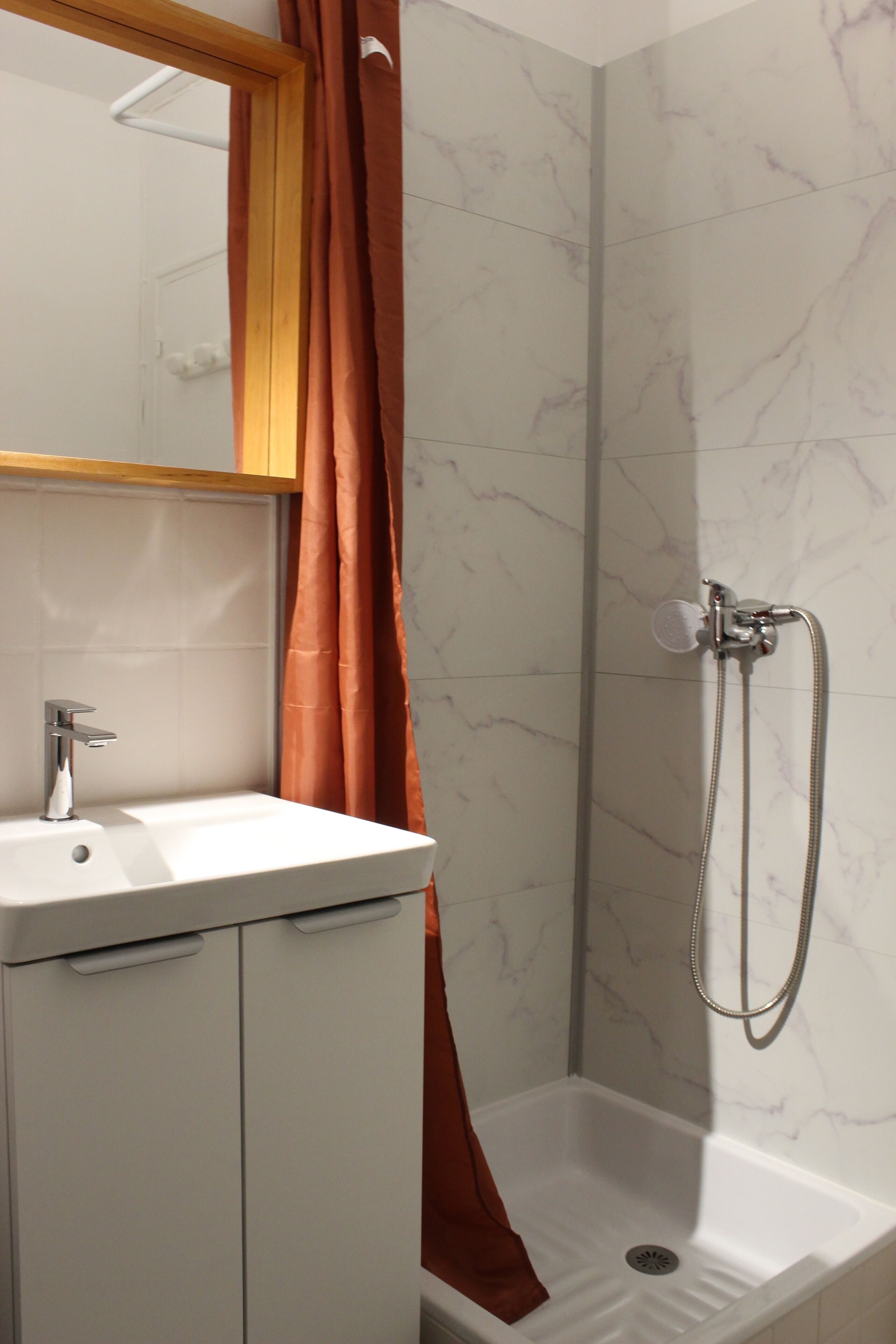 Shower, hair dryer, towels, toilet paper