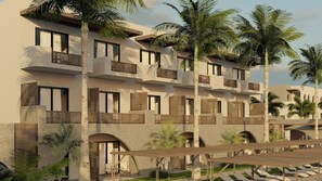 Un hôtel à plusieurs étages doté de balcons, de palmiers et d’un espace extérieur aménagé avec des sièges, protégé par un auvent.
