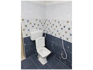 Shower, rainfall showerhead, slippers, towels