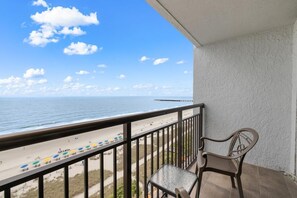 A balcony with a view of the beach and ocean. - Salty Air & Ocean Views – 10th Floor Retreat (Myrtle Beach)