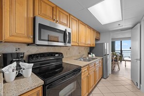 Fridge, microwave, oven, stovetop - Salty Air & Ocean Views – 10th Floor Retreat (Myrtle Beach)