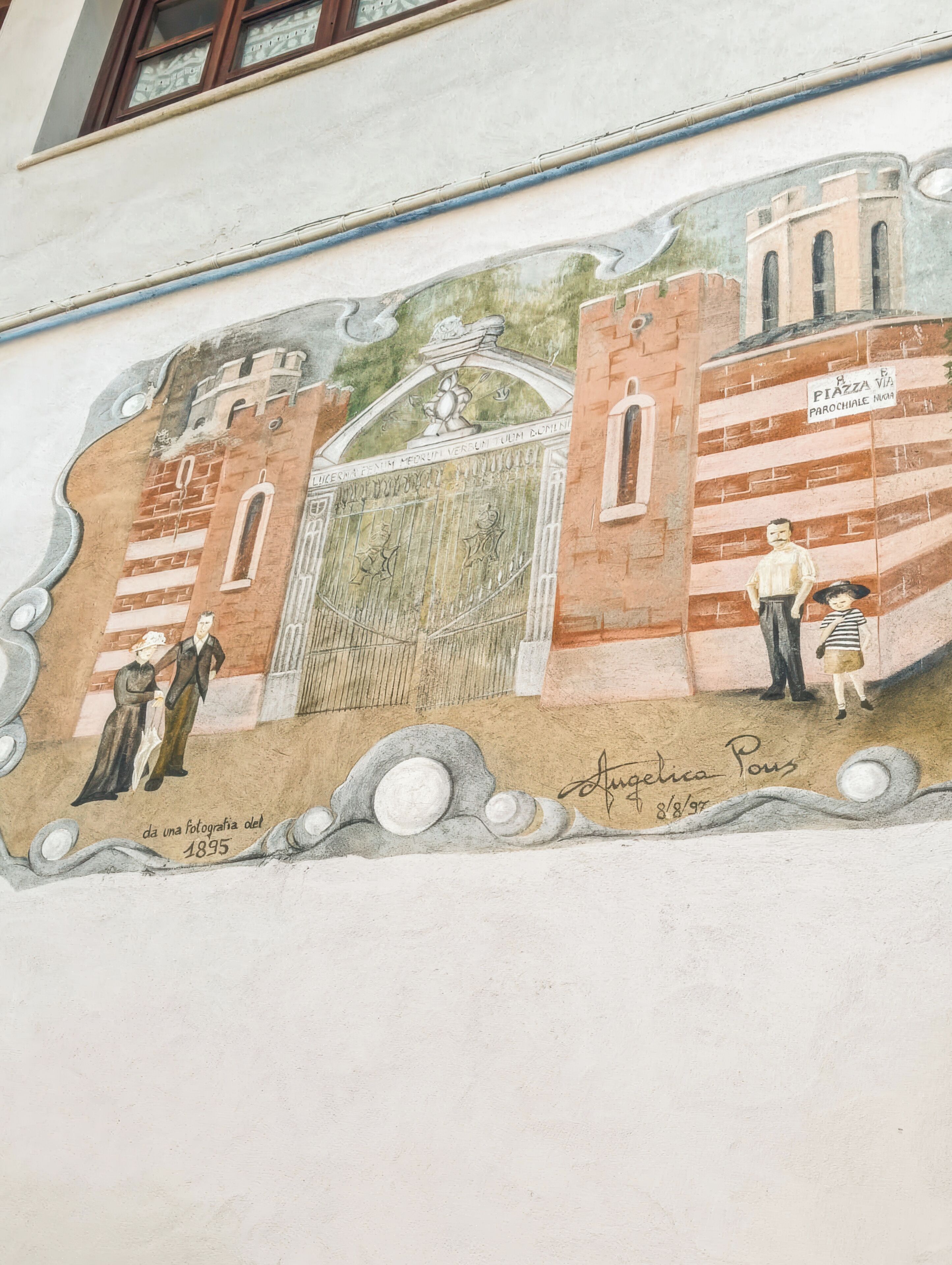 A mural with architectural elements and figures, including a date and signature.