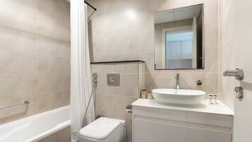 Exclusive Studio, Non Smoking, City View | Bathroom | Combined shower/tub, hair dryer, slippers, towels