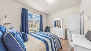 A bedroom with a bed, a dresser, a desk, and a window with curtains. - Cypress - Private Bedroom in Shared Home (Cypress)