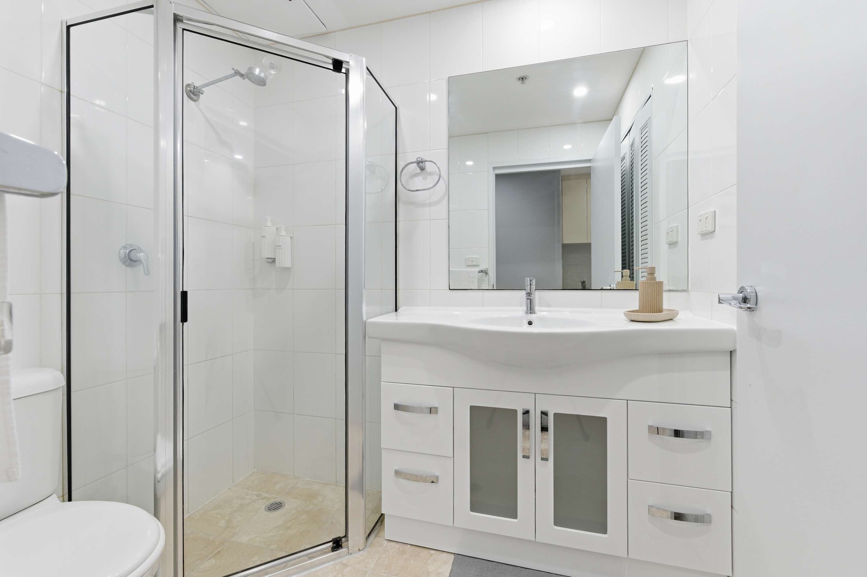 Shower, hair dryer, towels, shampoo
