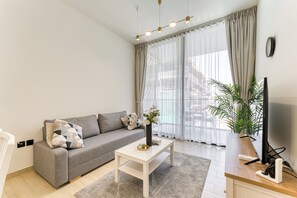 Exclusive Apartment, Non Smoking, Pool View | Living area | 40-inch Smart TV with digital channels - PVH - Cosy 2BR - Binghatti Crescent (Dubai)