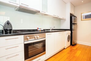 Fridge, microwave, stovetop, coffee/tea maker