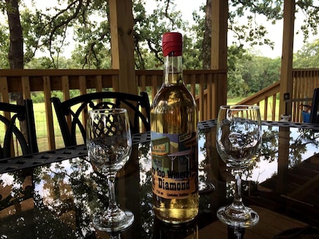 Outdoor dining. Rustic Cabin Rental with a Fishing Pond in Allen, Oklahoma