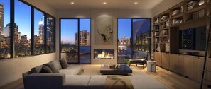 A modern living room with a sofa, coffee table, and fireplace. Large windows offer views of a city skyline. - Walkable 1BR nr Park Ave & Grand Central (New York)