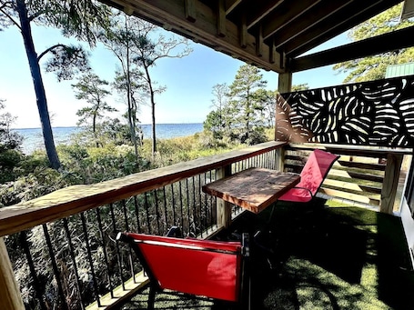 Outdoor dining. Elevated Cabin in the Trees Perfect for a Weekend Getaway in the Outer Banks, North Carolina
