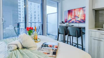 Comfort Studio Suite, 1 Queen Bed with Sofa bed, Non Smoking, City View | Living room | 50-inch TV with digital channels