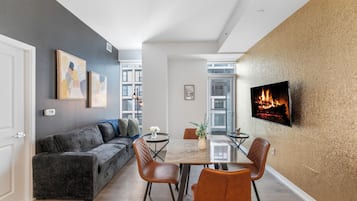 Executive Suite, 1 Bedroom, Non Smoking, City View | Living area | 50-inch TV with digital channels