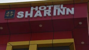 A building with a sign that reads 'HOTEL SHARINN'. - Hotel Shar Inn (Balrampur)
