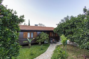 Casa família, vista para o jardim | Fachada