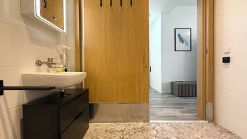 Superior Studio | Bathroom | Shower, hair dryer, towels, soap