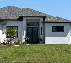 Exterior - Newly Built Modern Vacation Home 4 BR/3 BA Your Own Heated Pool, Lanai on Canal (Cape Coral)
