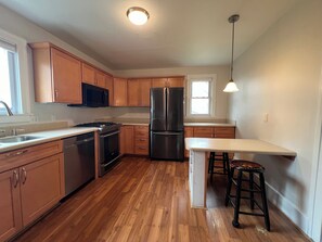 Fridge, microwave, oven, stovetop - 3 bedroom, 1.5 bathroom furnished two story home downtown Traverse City in Boardman Neighborhood available for 30 day stays. Perfect for families and one or two dogs with large fenced-in backyard! (Traverse City)