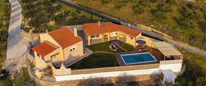 A large house with a swimming pool, multiple rooms, and a fenced yard. - Sunny Villa Elia- 4 bedroom villa with private pool, sea and mountain view (Iraklio)