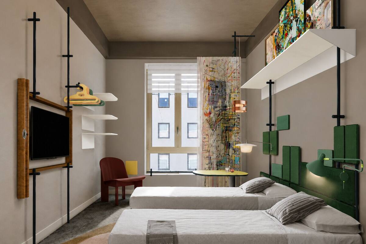 A modern hotel room with two beds, a TV, a desk, and artwork on the walls.