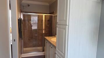 Shower, hair dryer, towels, soap