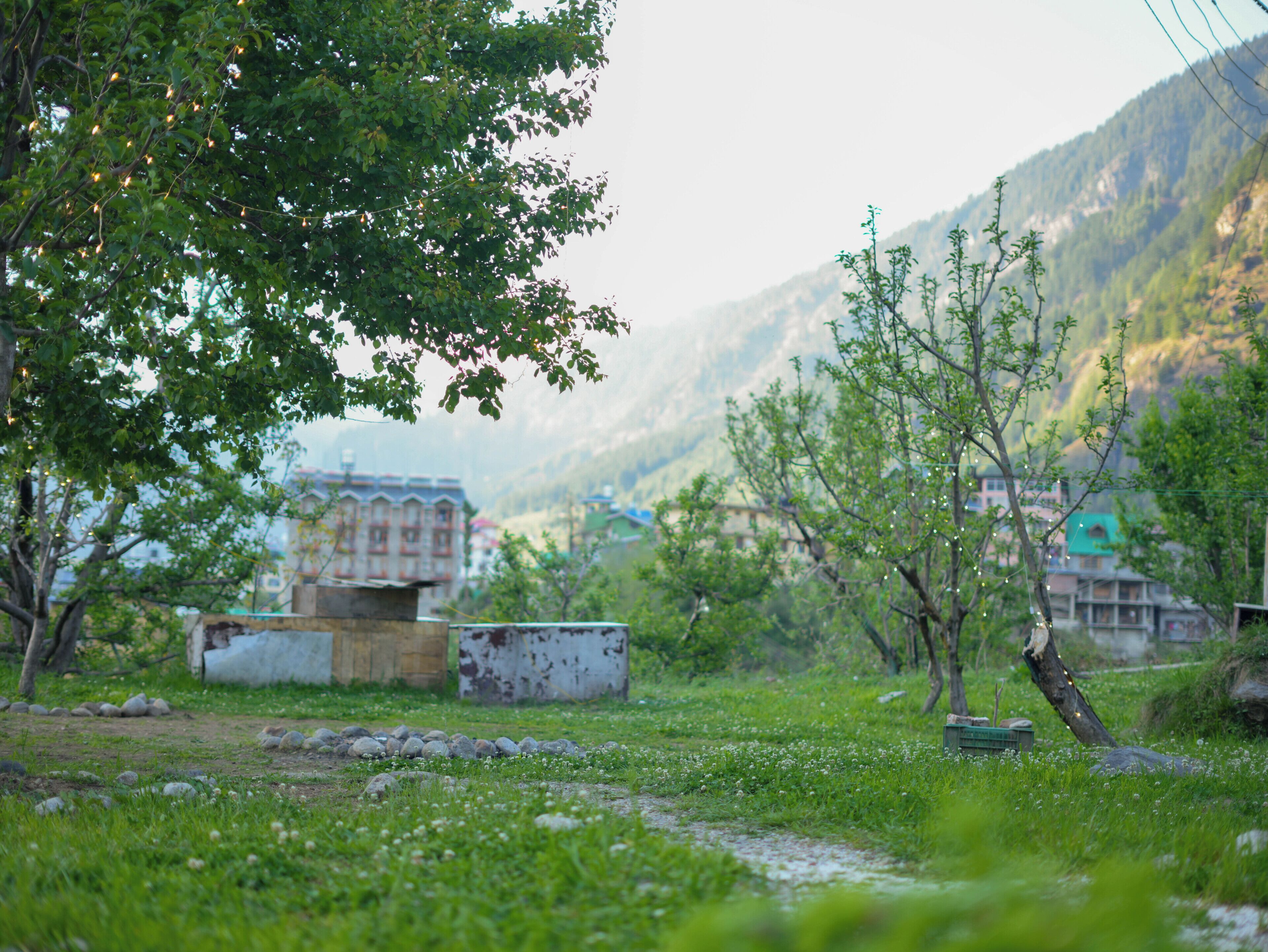 A mountainous landscape with a building in the background.