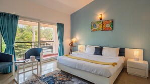 A bedroom with a bed, bedside tables, a chair, a window with curtains, and a balcony. - Alaya Stays 3 BHK Casa Bella Vista  (Nerul)