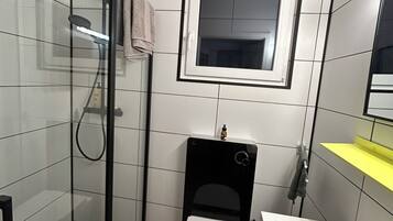 Shower, hair dryer, towels, soap