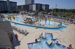 A resort with a large pool area, including a water slide and multiple swimming pools. - The Getaway (Myrtle Beach)