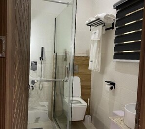 Shower, free toiletries, slippers, towels
