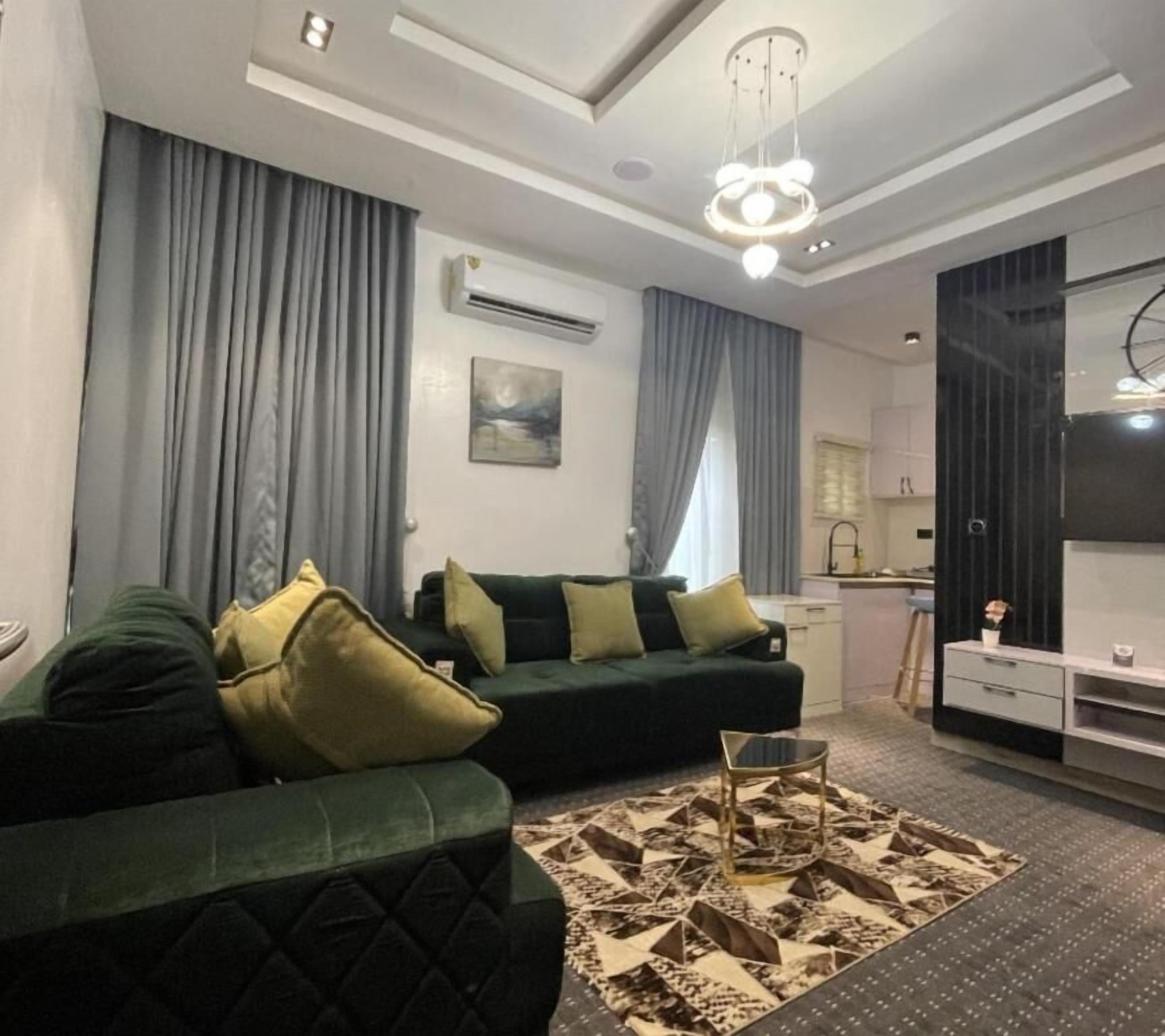 Suite Confort, balcon, vue ville | Coin séjour
