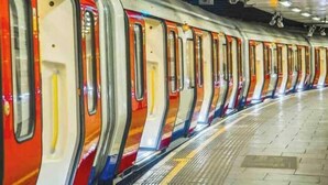 A subway train with multiple doors and windows, a tiled floor, and overhead lighting. - Luxury Soho House Residence – Gym, Pool, Cinema & Prime London Living (London)