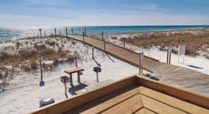 A wooden boardwalk leading to a beach with dunes and a clear view of the ocean. - Paradise on the Point: Mermaid suite, Steps from the Beach, & Harbor. (Destin)