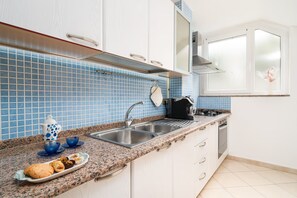 Fridge, microwave, oven, stovetop - Cala Biriala - One Bedroom Apartment, Sleeps 4 (Orosei)