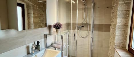 Shower, hair dryer, towels, soap