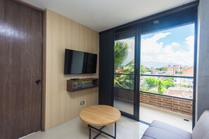 Family Loft, Balcony, City View | Living area | 40-cm flat-screen TV with digital channels - Hotel Distrito 70 Living  (Medellín)