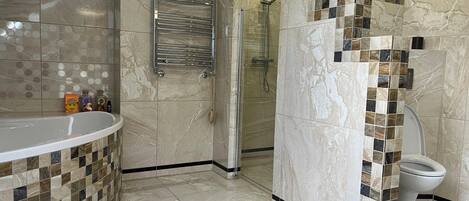 Shower, hair dryer, towels, toilet paper