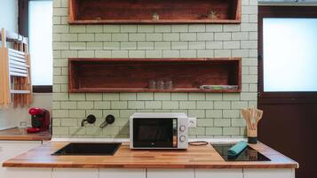 Microwave, coffee/tea maker, toaster, cookware/dishes/utensils