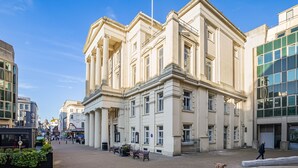 A historic building with classical architecture, a paved square, and benches. - Brighton Central Seaview Retreat, Steps to the Beach (Brighton and Hove)