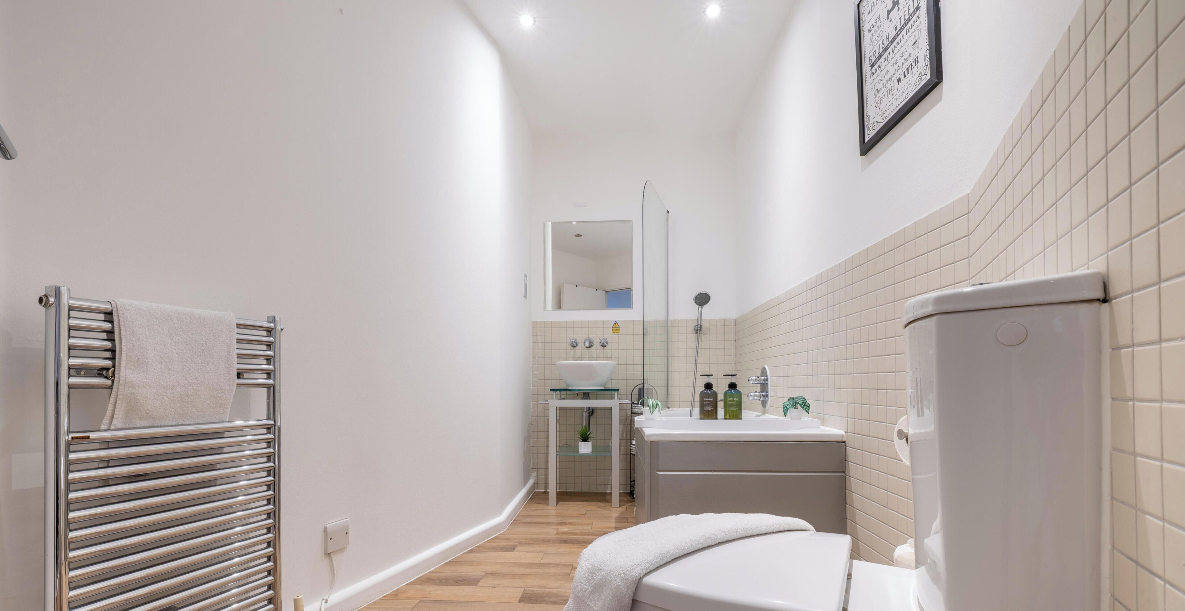 Shower, hair dryer, towels, soap