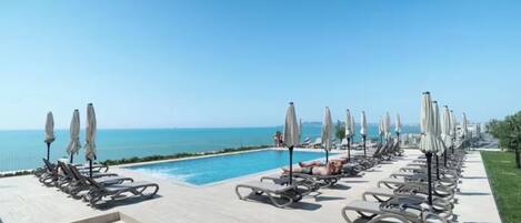 Seasonal outdoor pool, pool umbrellas, pool loungers