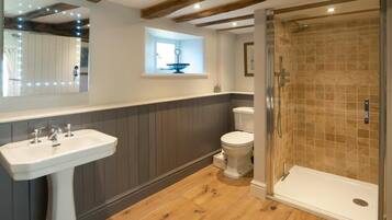 Separate bathtub and shower, deep-soaking bathtub, towels