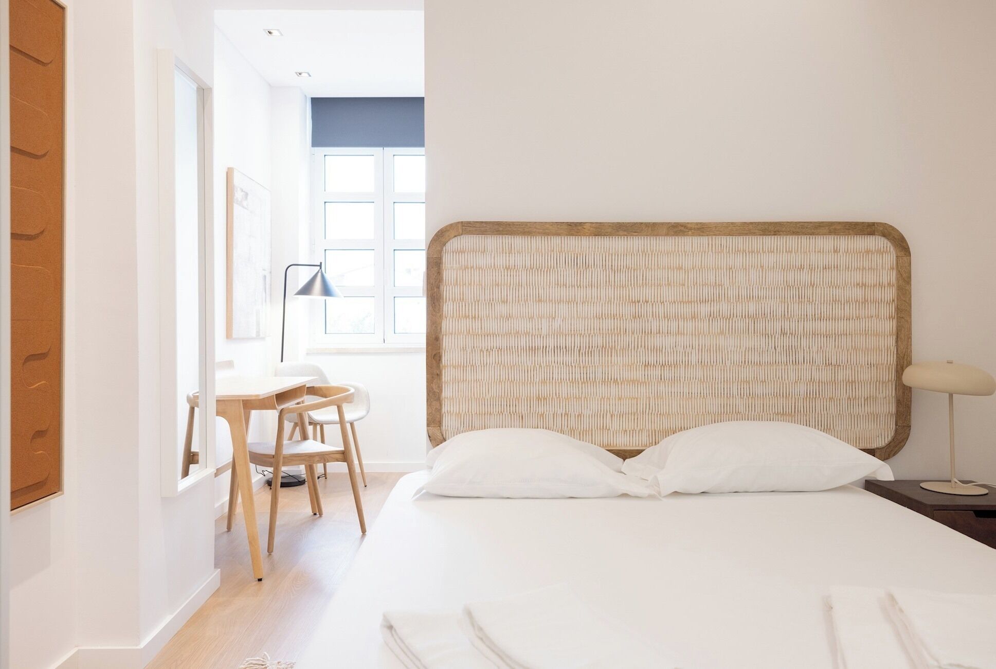Desk, iron/ironing board, bed sheets