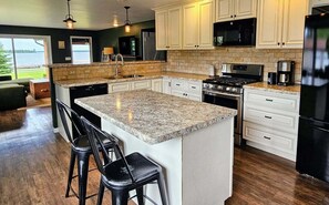 Fridge, microwave, oven, stovetop - Hessel Bay Resort:  6 cabins + main house.  Sleeps 28. Waterfront Lake Huron.  Boat dock! (Hessel)