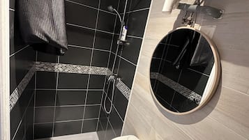 Shower, towels, soap, toilet paper