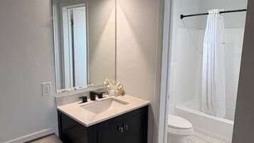 Economy Double Room, 2 Queen Beds, Non Smoking, Mountain View | Bathroom | Combined shower/tub, hair dryer, towels, soap