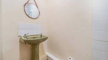 Separate bathtub and shower, deep-soaking bathtub, towels