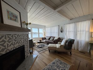 TV, fireplace, books - Firefly Cottages on Bass Lake | Sandy Frontage, Dock, Kayaks, Near Downtown TC (Traverse City)