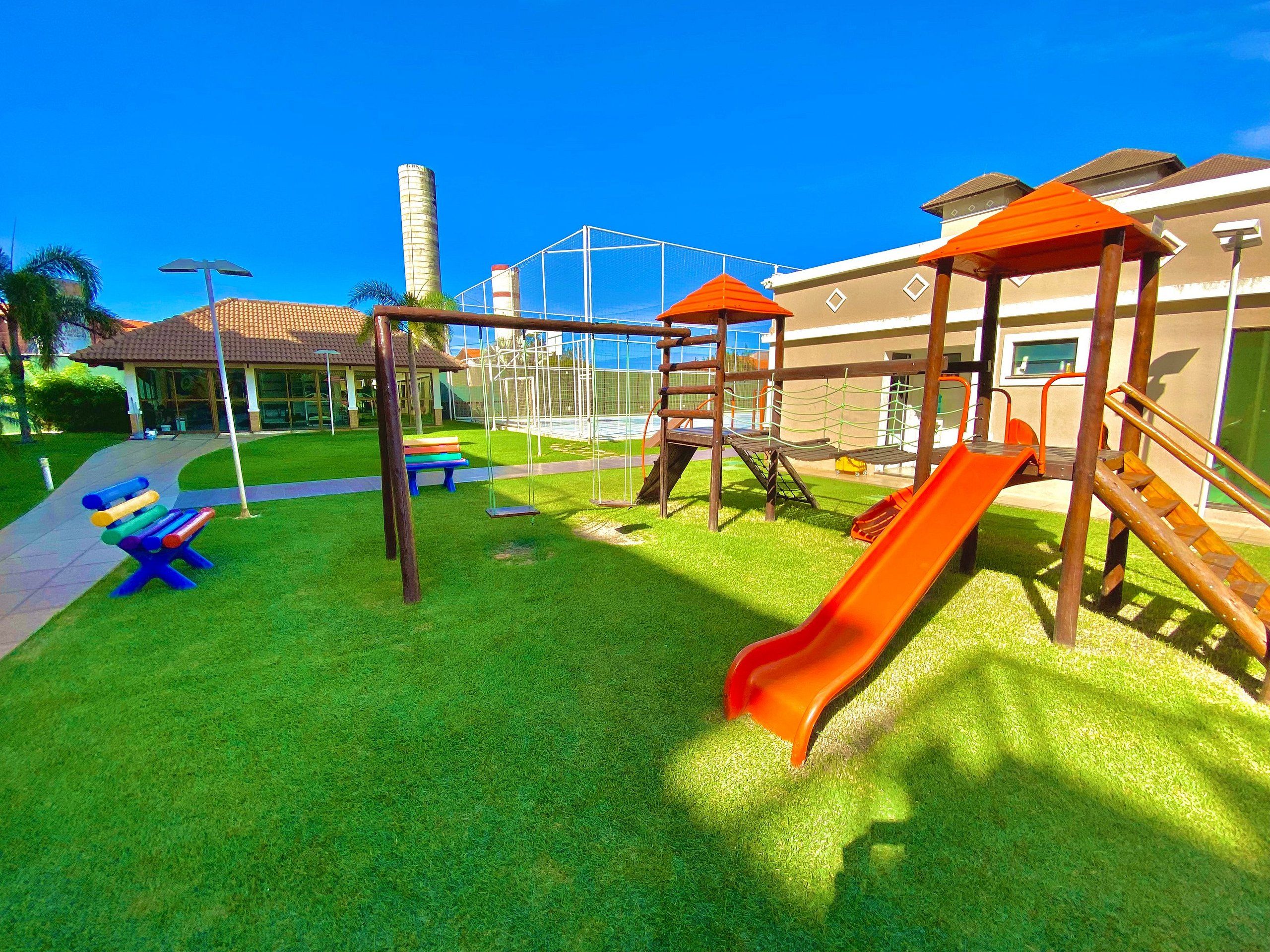 A playground with slides and swings.