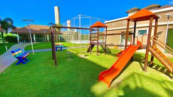 A playground with slides and swings.